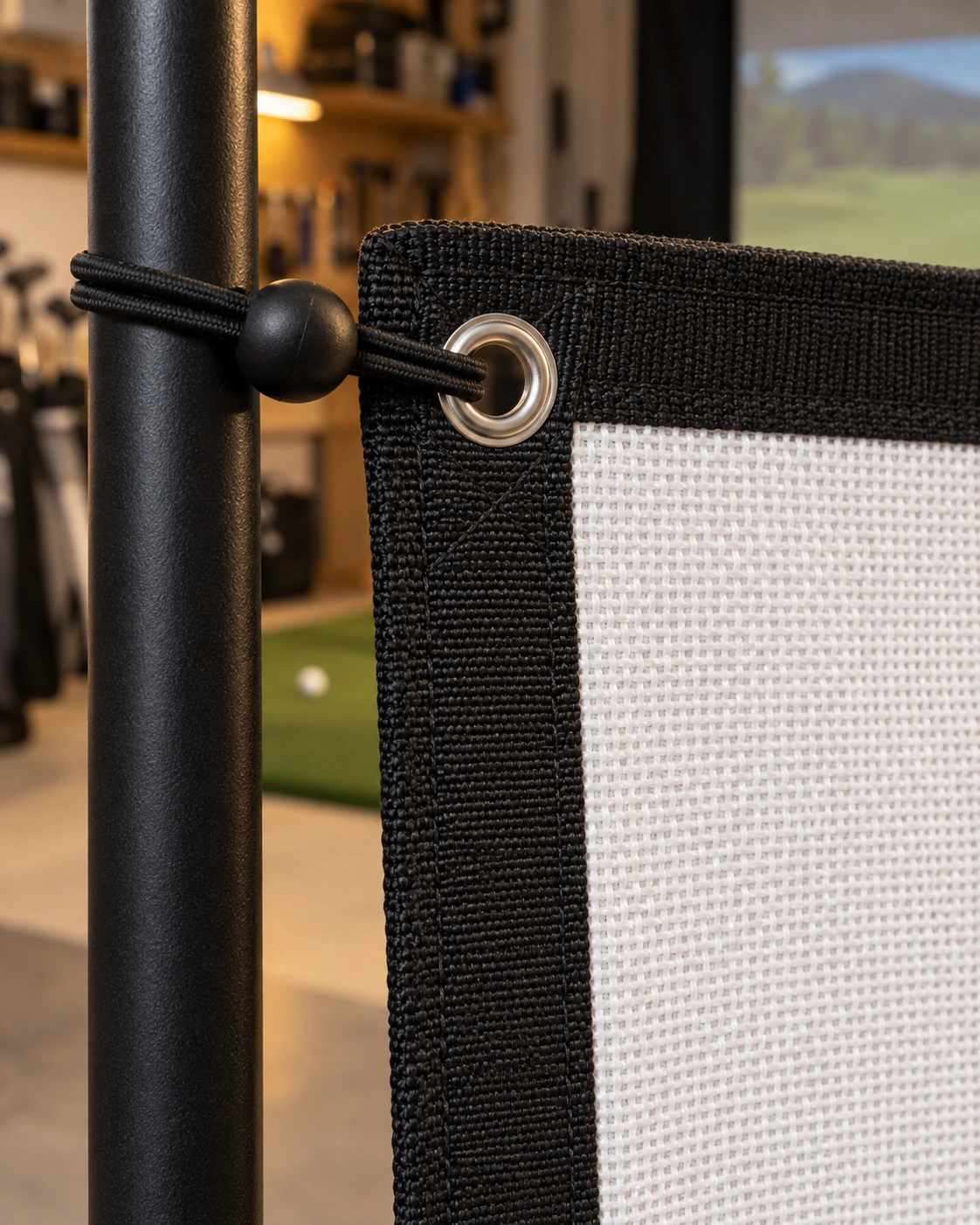 Woven golf impact screen, reinforced border and mounting bungee